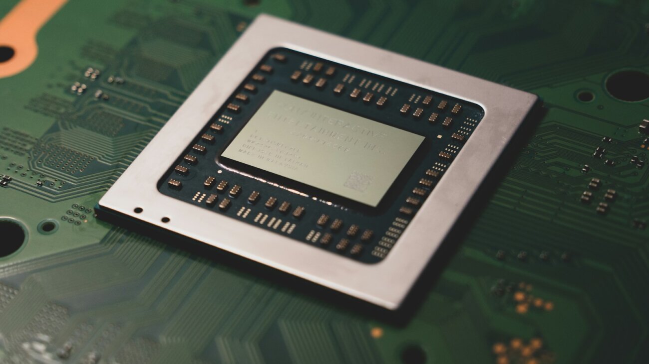 Close-up of a processor chip on a circuit board, symbolising AI automation